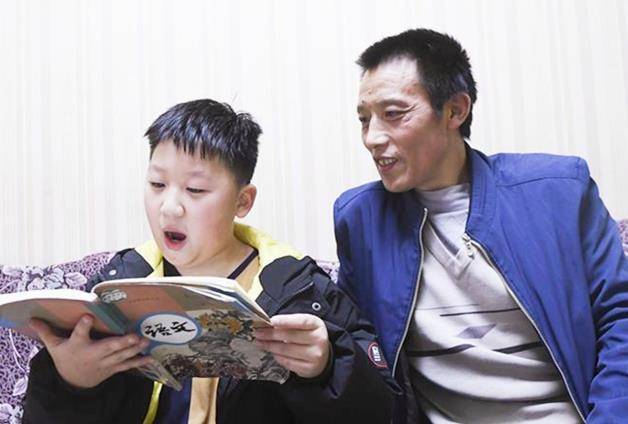 11年前,这张父子照曾火遍全国,如今他们的故事更加动人